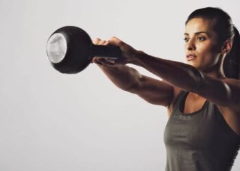 Fix your form: Two-arm overhead kettlebell squat