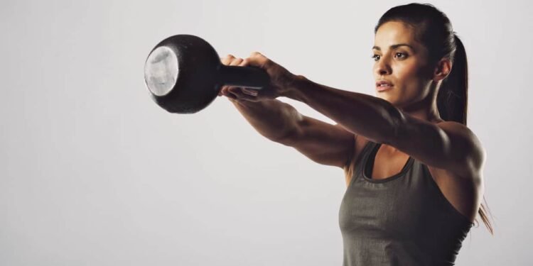 Fix your form: Two-arm overhead kettlebell squat