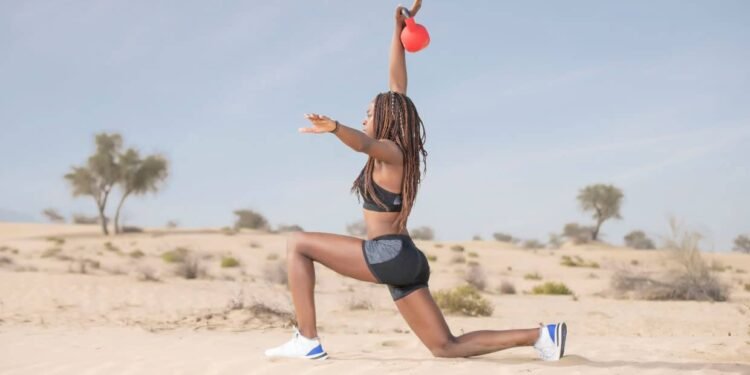 Master the move: Walking lunge with overhead press